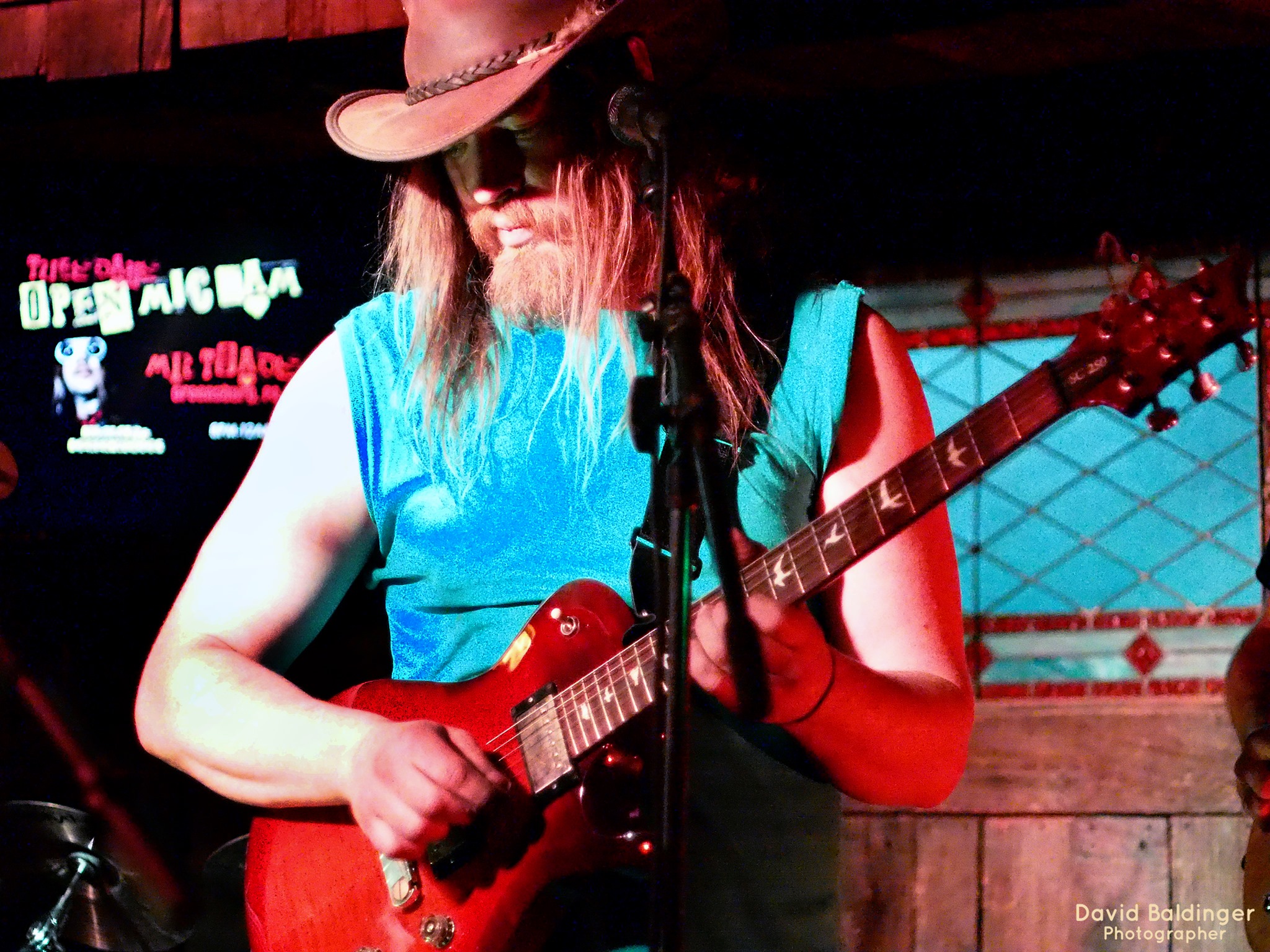 Band member playing guitar